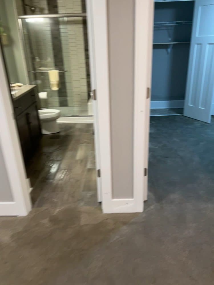 Finished basement bathroom and hallway after restoration