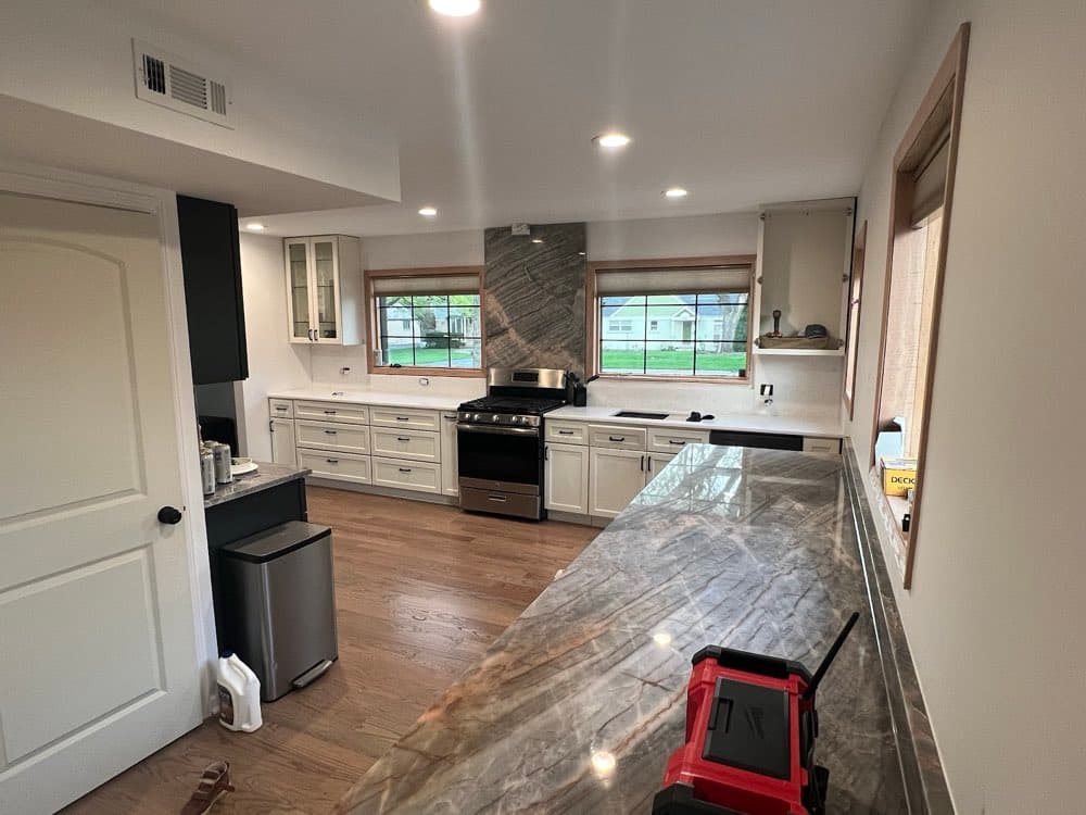 Finished kitchen with stone counters after reconstruction