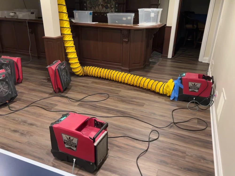Drying equipment and ducting running in a finished basement bar