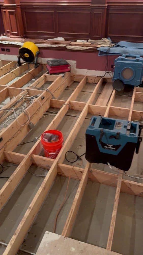 Exposed floor joists with drying equipment placed between them