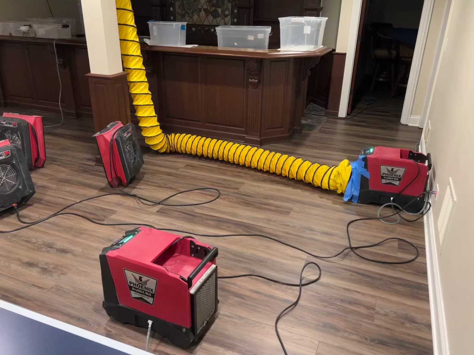 Drying equipment and ducting running in a finished basement bar on the Hinsdale job