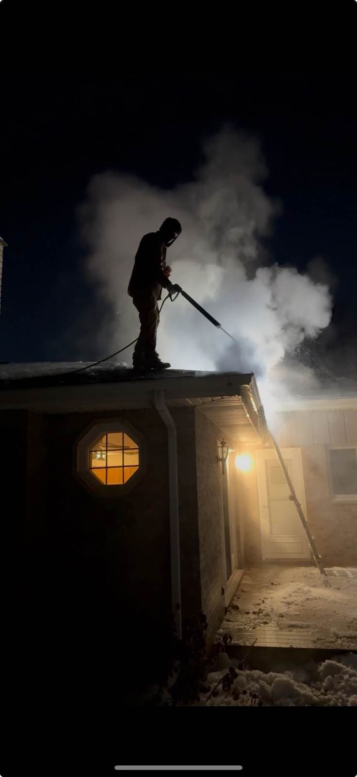Steaming the ice dam off the roof on a night call